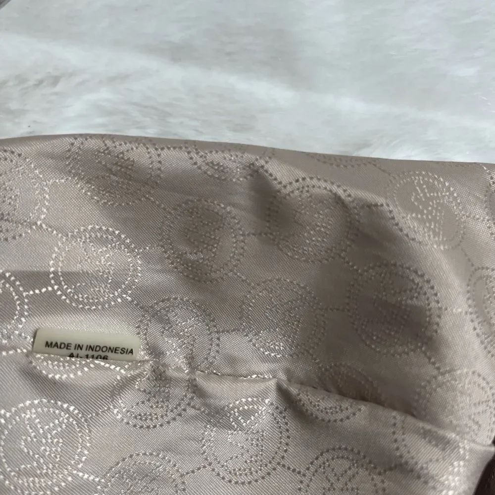 Michael Michael Kors leather beige drawstring bucket satchel.silver tone accents